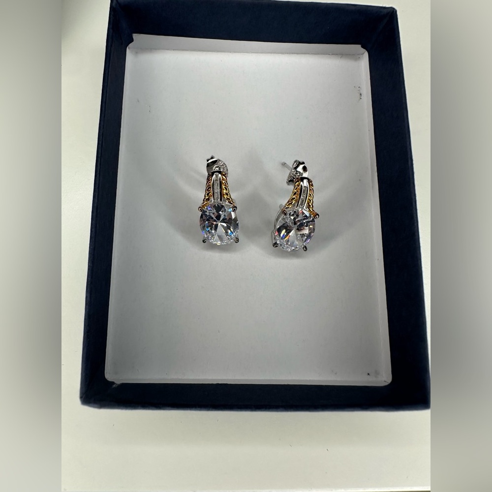 The Bradford exchange 18k gold plated earrings set with 8.5 carats of diamonesk